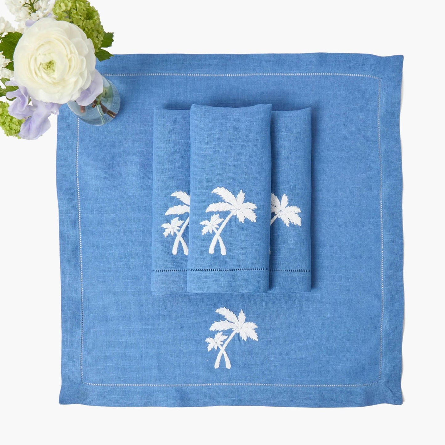 Tovagliette all'americana in lino blu Eloise e tovaglioli con palme (set da 4)