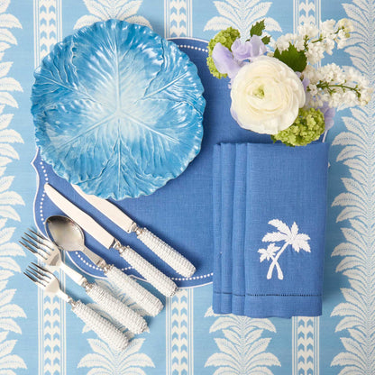Tovagliette all'americana in lino blu Eloise e tovaglioli con palme (set da 4)