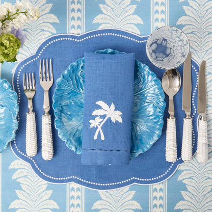 Tovagliette all'americana in lino blu Eloise e tovaglioli con palme (set da 4)